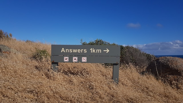 Signpost for the town of Answers being 1km away. Used for a header image for the FAQ link.